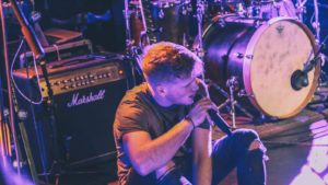 Pro Music Help - Singer on stage with microphone